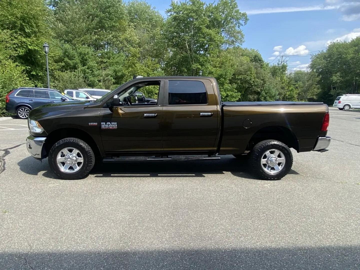 2013 Bronz /Grey RAM 2500 SLT Crew Cab SWB 4WD (3C6TR5DT8DG) with an 5.7L V8 OHV 16V engine, 6A transmission, located at 215 Milton St, Dedham, MA, 02026, (781) 329-5144, 42.241905, -71.157295 - This Bronze 2013 RAM 2500 is the kind of truck that looks ready for work even when it’s headed out for the weekend. Under the hood, the 5.7L gasoline V8 brings the muscle, while 4WD and a confident mix of traction control, ABS, and stability control help keep things planted when the road (or jobsi- Photo#5