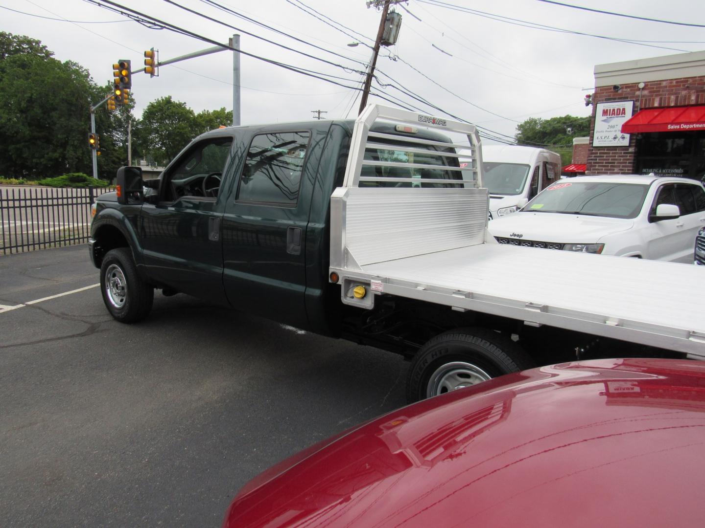 2012 Green /Gray Ford F-250 SD King Ranch Crew Cab 4WD (1FT7W2B63CE) with an 6.2L V8 OHV 16V engine, 6-Speed Automatic transmission, located at 215 Milton St, Dedham, MA, 02026, (781) 329-5144, 42.241905, -71.157295 - This nice plow truck has a brand-new Aluminum bed. Frame is in excellent condition and has been coated. Comes with an 8' Fisher Minute Ma plow and Fish Stick controller. All ASPI Motor Cras vehicles are fully serviced before they are delivered. All Commercial vehicles are sold as-is. We encourage al- Photo#4