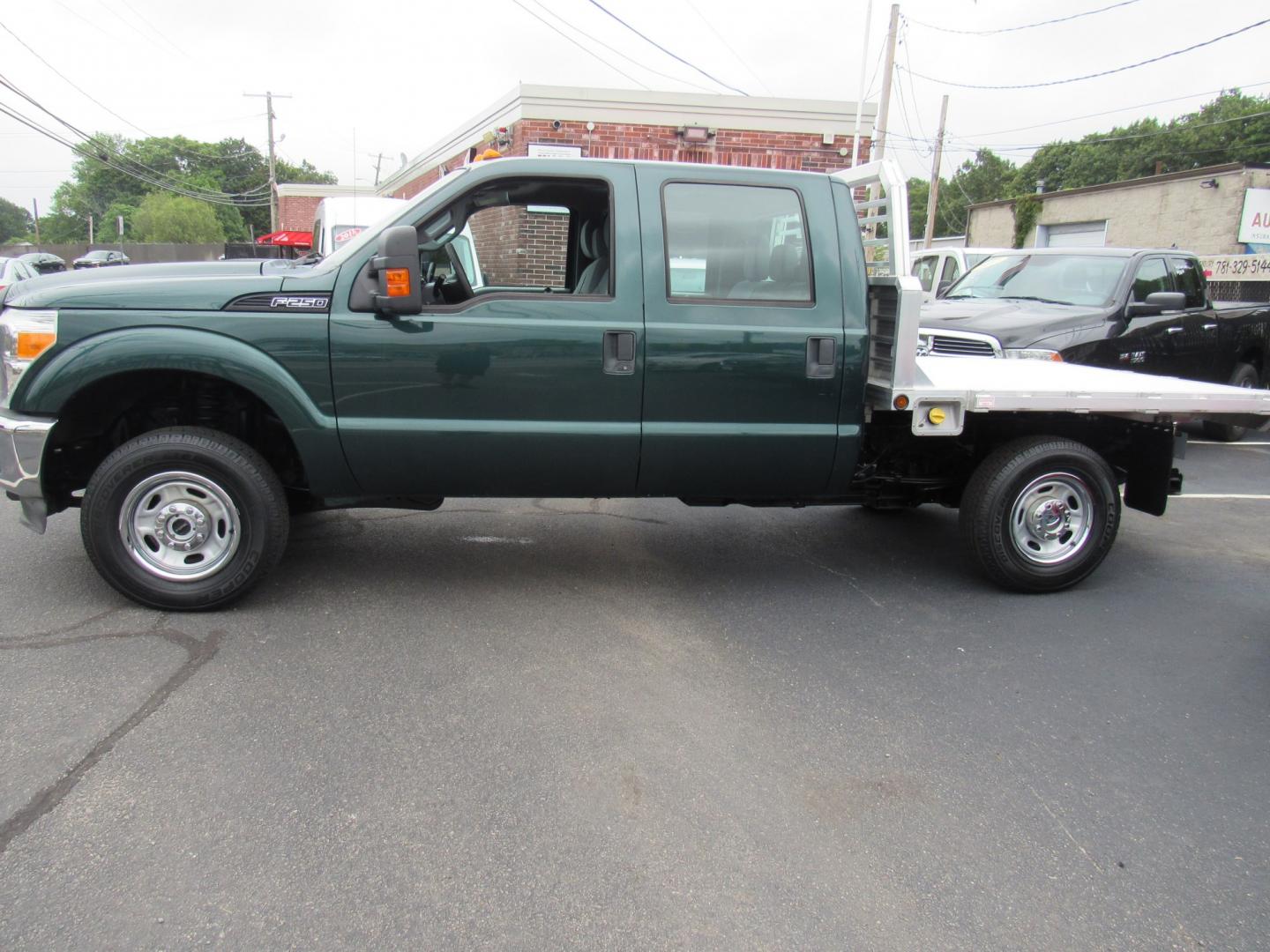 2012 Green /Gray Ford F-250 SD King Ranch Crew Cab 4WD (1FT7W2B63CE) with an 6.2L V8 OHV 16V engine, 6-Speed Automatic transmission, located at 215 Milton St, Dedham, MA, 02026, (781) 329-5144, 42.241905, -71.157295 - This nice plow truck has a brand-new Aluminum bed. Frame is in excellent condition and has been coated. Comes with an 8' Fisher Minute Ma plow and Fish Stick controller. All ASPI Motor Cras vehicles are fully serviced before they are delivered. All Commercial vehicles are sold as-is. We encourage al- Photo#3