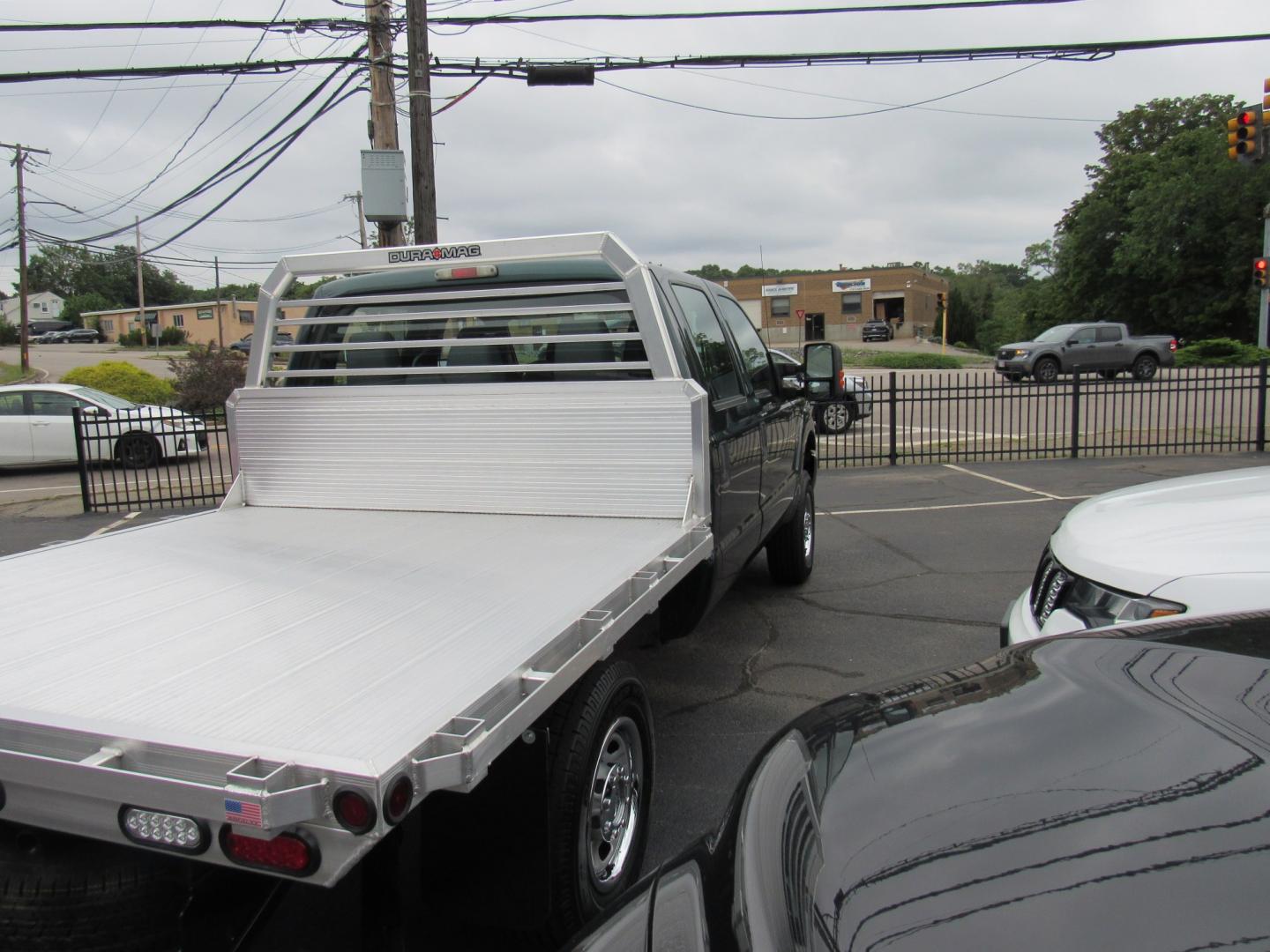 2012 Green /Gray Ford F-250 SD King Ranch Crew Cab 4WD (1FT7W2B63CE) with an 6.2L V8 OHV 16V engine, 6-Speed Automatic transmission, located at 215 Milton St, Dedham, MA, 02026, (781) 329-5144, 42.241905, -71.157295 - This nice plow truck has a brand-new Aluminum bed. Frame is in excellent condition and has been coated. Comes with an 8' Fisher Minute Ma plow and Fish Stick controller. All ASPI Motor Cras vehicles are fully serviced before they are delivered. All Commercial vehicles are sold as-is. We encourage al- Photo#6