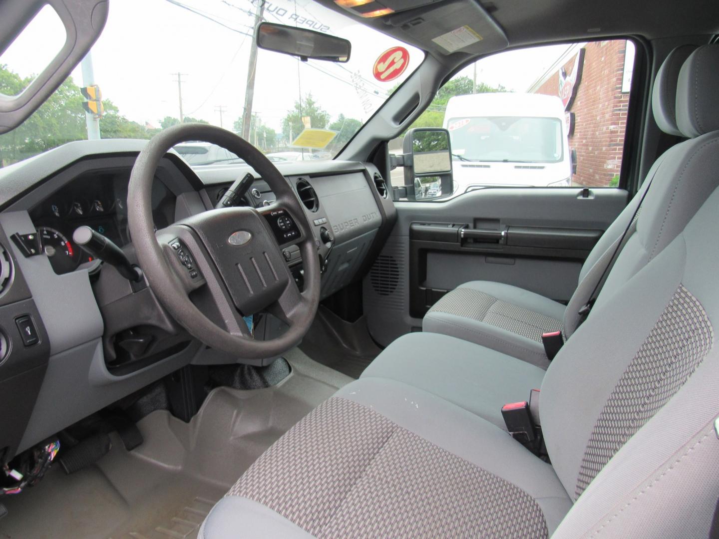 2012 Green /Gray Ford F-250 SD King Ranch Crew Cab 4WD (1FT7W2B63CE) with an 6.2L V8 OHV 16V engine, 6-Speed Automatic transmission, located at 215 Milton St, Dedham, MA, 02026, (781) 329-5144, 42.241905, -71.157295 - This nice plow truck has a brand-new Aluminum bed. Frame is in excellent condition and has been coated. Comes with an 8' Fisher Minute Ma plow and Fish Stick controller. All ASPI Motor Cras vehicles are fully serviced before they are delivered. All Commercial vehicles are sold as-is. We encourage al- Photo#15