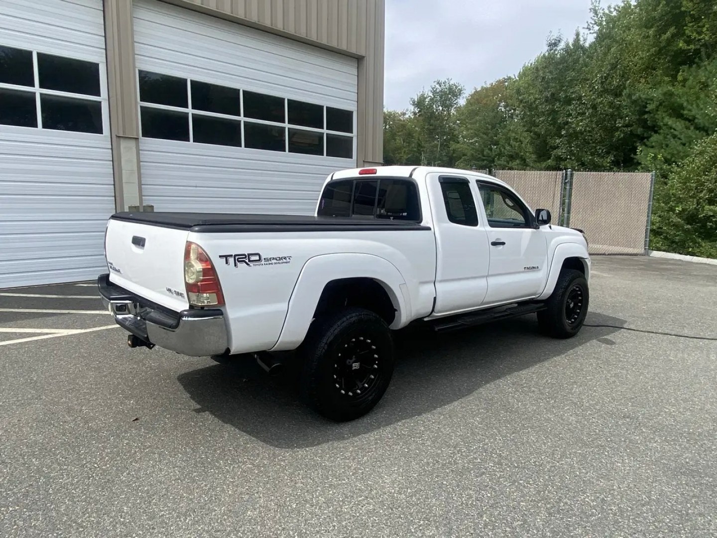 2011 White /Tan Toyota Tacoma Access Cab V6 4WD (5TFUU4EN8BX) with an 4.0L V6 DOHC 24V engine, 5M transmission, located at 215 Milton St, Dedham, MA, 02026, (781) 329-5144, 42.241905, -71.157295 - Get ready to hit the road in this rugged and reliable 2011 Toyota Tacoma! This white beauty is equipped with all the essentials to make your driving experience smooth and secure. From the powerful anti-lock braking system to the stability control system, you can drive with confidence knowing that yo- Photo#3