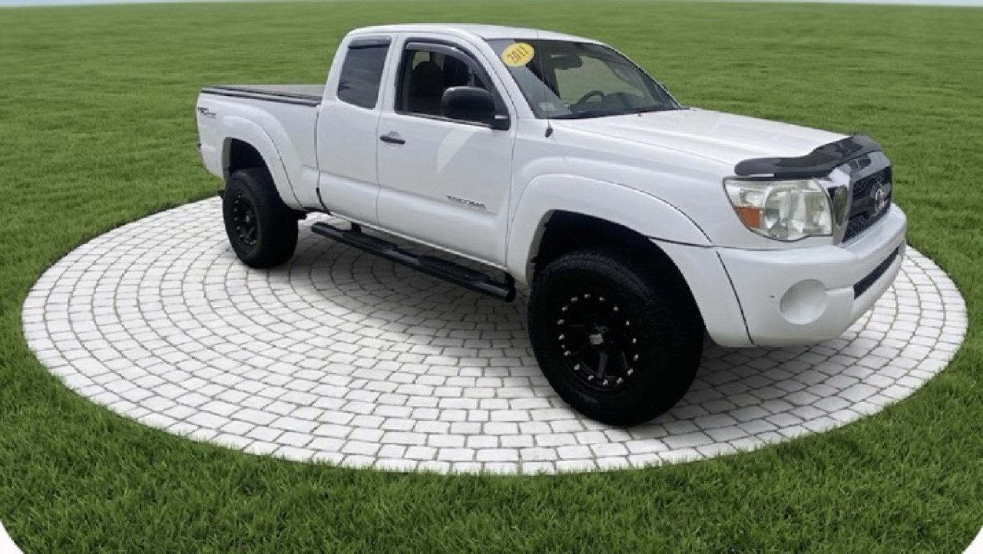 2011 White /Tan Toyota Tacoma Access Cab V6 4WD (5TFUU4EN8BX) with an 4.0L V6 DOHC 24V engine, 5M transmission, located at 215 Milton St, Dedham, MA, 02026, (781) 329-5144, 42.241905, -71.157295 - Get ready to hit the road in this rugged and reliable 2011 Toyota Tacoma! This white beauty is equipped with all the essentials to make your driving experience smooth and secure. From the powerful anti-lock braking system to the stability control system, you can drive with confidence knowing that yo- Photo#0