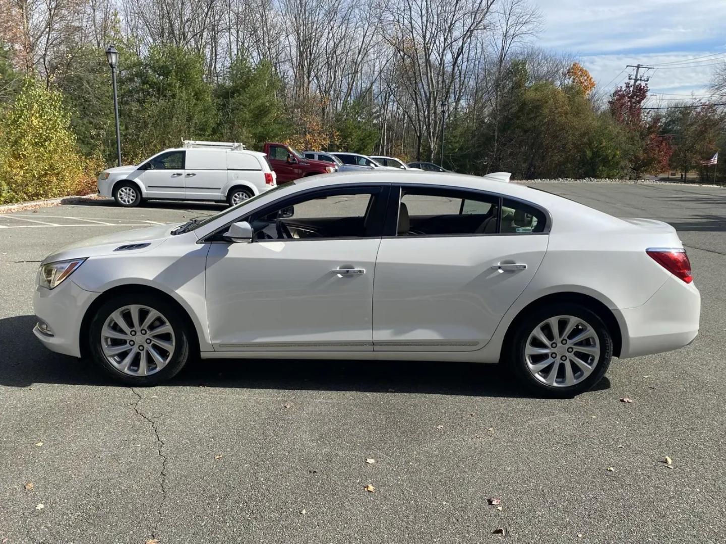 2016 Pearl /Tan Buick LaCrosse Leather Package (1G4GB5G36GF) with an 3.6L V6 DOHC 24V FFV engine, 6A transmission, located at 215 Milton St, Dedham, MA, 02026, (781) 329-5144, 42.241905, -71.157295 - Slide into this Pearl White 2016 Buick LaCrosse and you’ll see why it’s such a great everyday upgrade: a smooth, quiet sedan with a confident FWD stance, an automatic transmission, and a strong 3.6L V6 under the hood. It’s the kind of car that makes commutes feel shorter and road trips feel ea- Photo#5